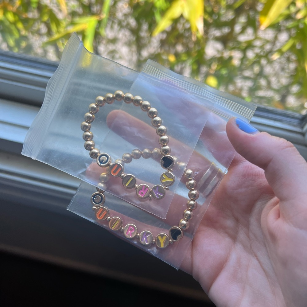 Custom beaded bracelets with word “quirky”